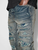 Amiri PJ Thrasher Distressed Effect Ripped Jeans in Blue