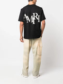 Amiri Staggered Logo T-Shirt in Black